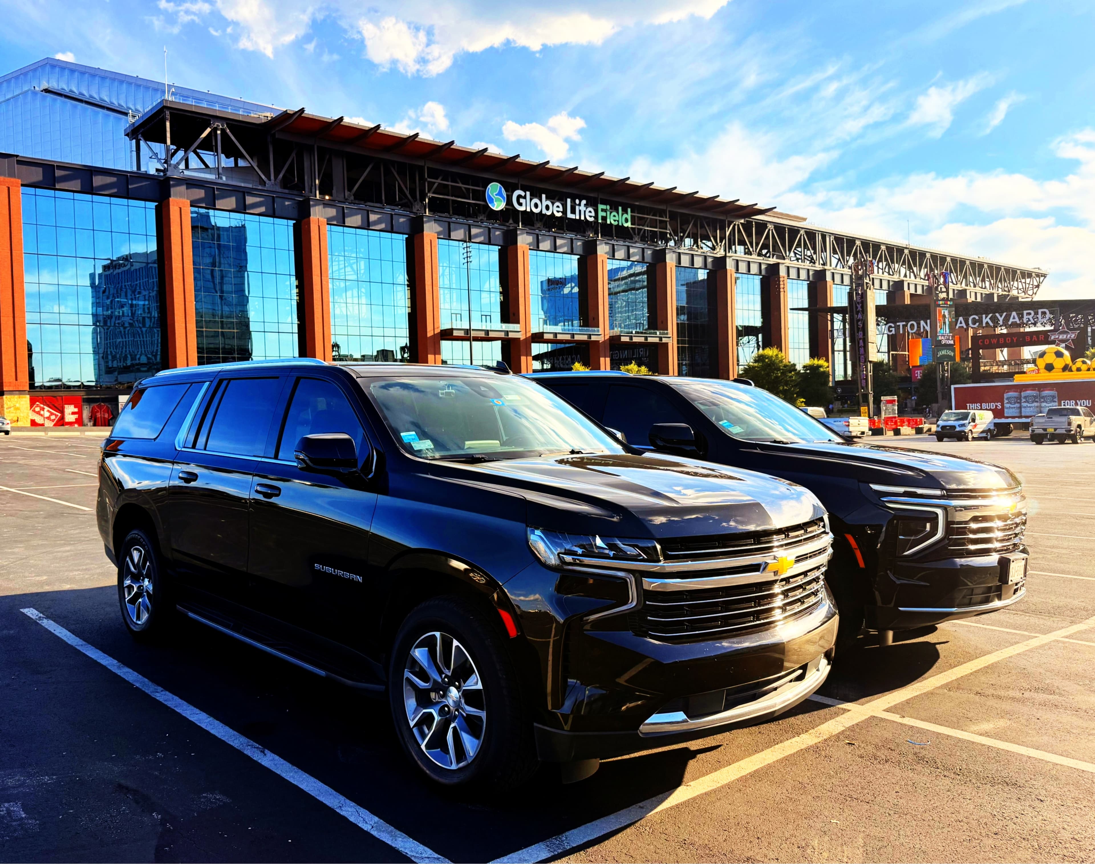 Blitz Limo black car service vehicles parked outside Globe Life Field in Arlington, TX